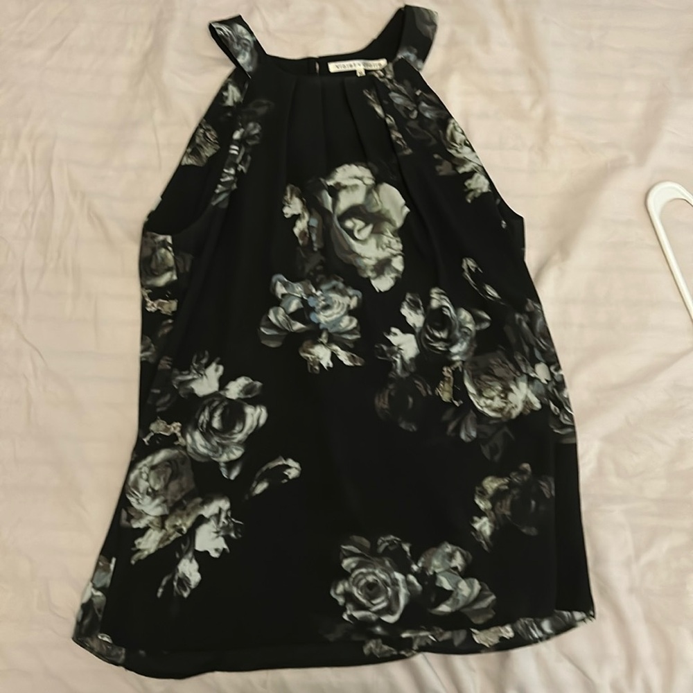 Floral blouse. Black with white floral pattern with light blue accent color